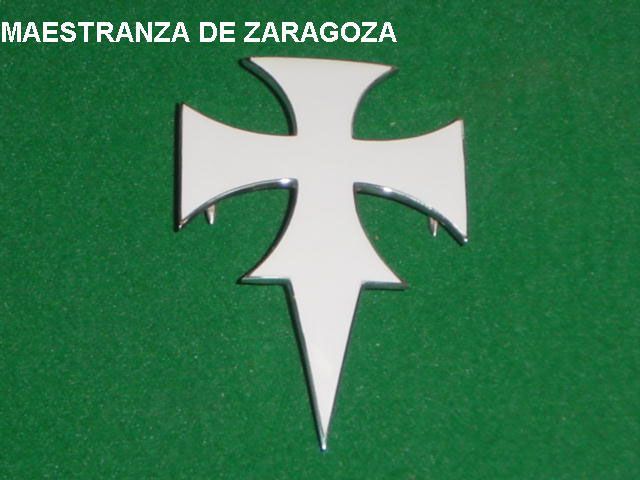 Una cruz blanca sobre fondo verde que dice maestranza de zaragoza