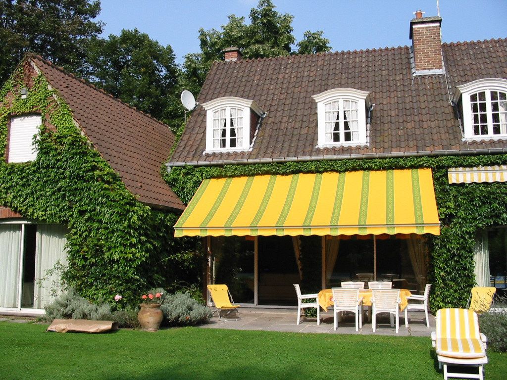 Store banne en tissu jaune à bandes verte