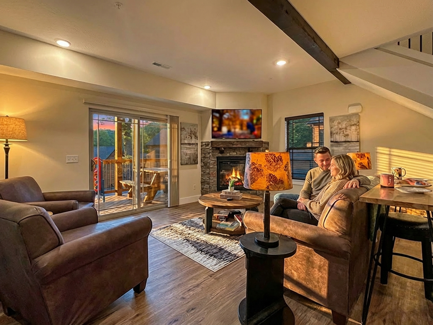 Cozy romantic living room with fireplace and balcony at Branson Missouri vacation rental condo