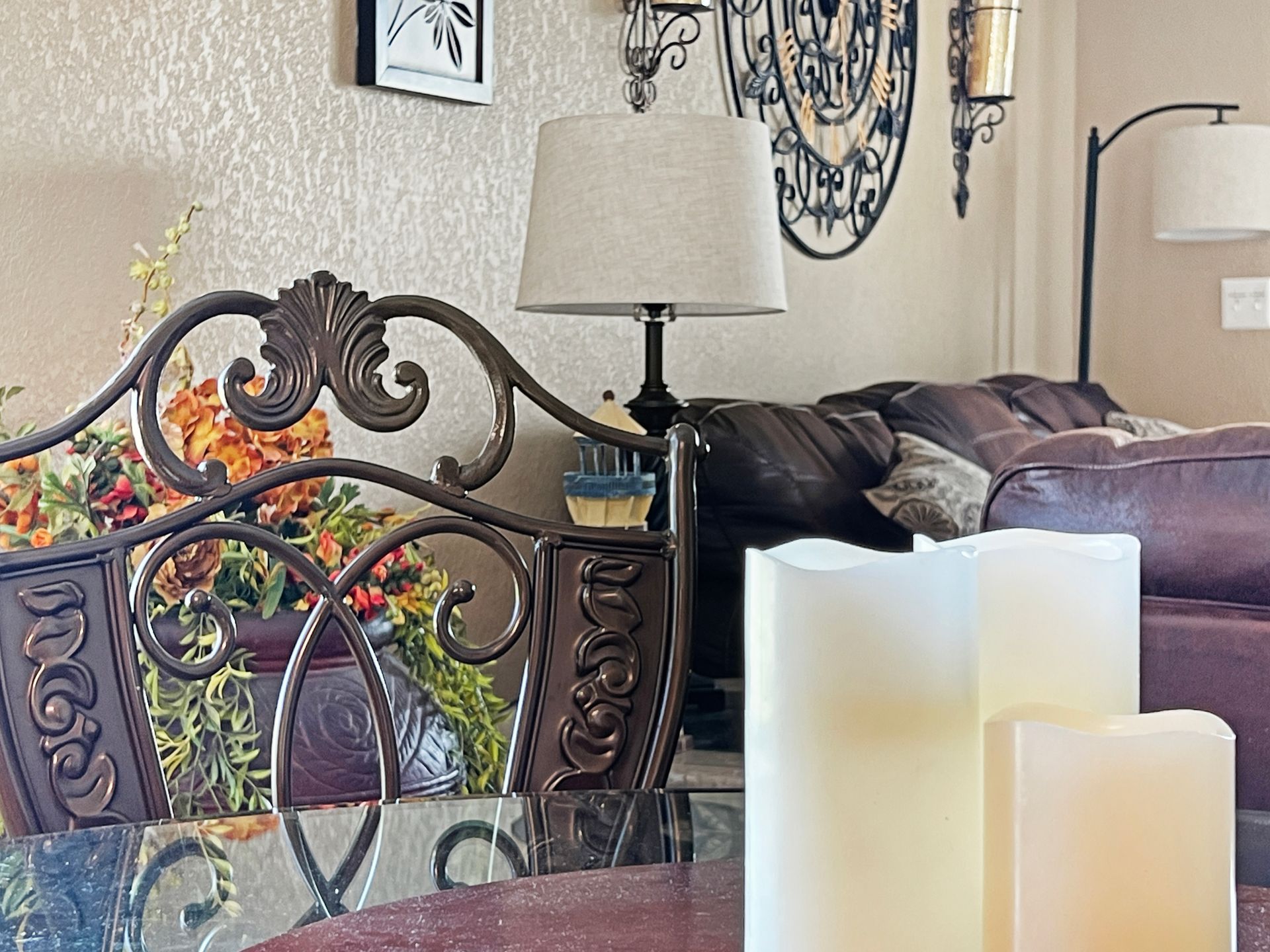 A living room with a couch and a table with candles on it