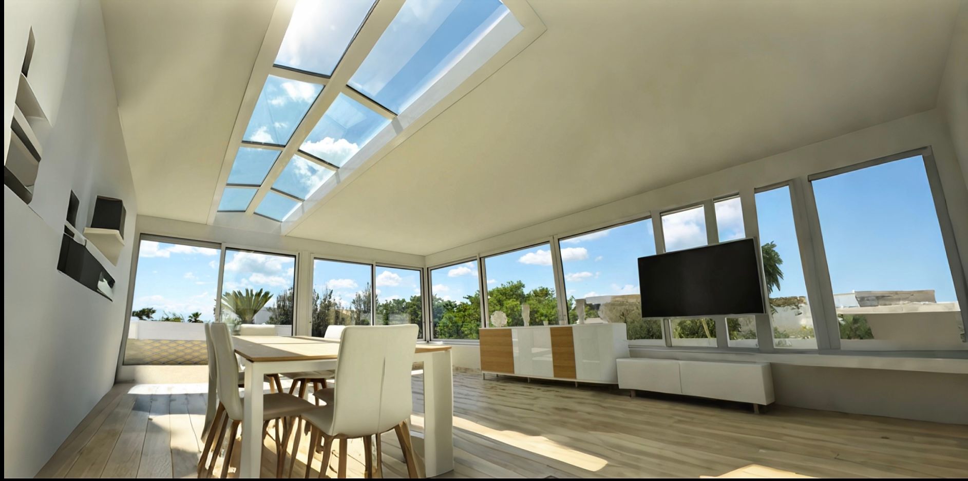 Une salle à manger moderne et lumineuse avec puits de lumière, une table à manger et une télévision au mur.