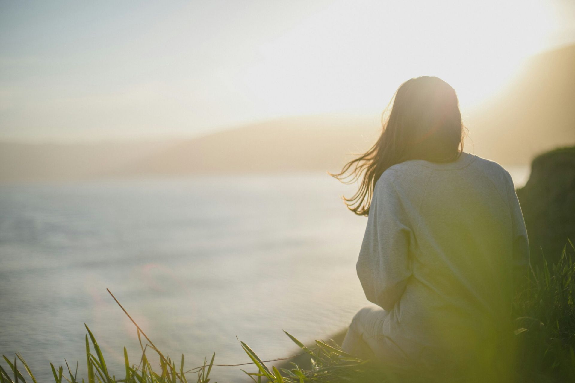 Creative Retreats in Gearhart - Woman gazing at sunset on the Oregon Coast