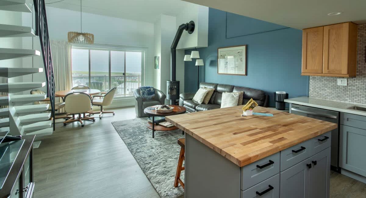 Interior of a recently renovated Gearhart by the Sea condo unit showing kitchen and living area