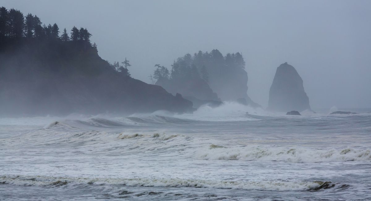 Winter storm waves hitting Cannon Beach sea stacks on the Oregon coast