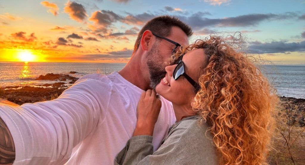 Couple embracing at sunset along the Oregon Coast near Gearhart Beach