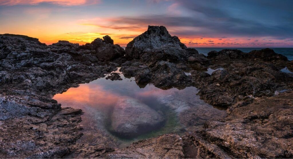 Rocky tide pools along the Oregon Coast near Cannon Beach at sunset