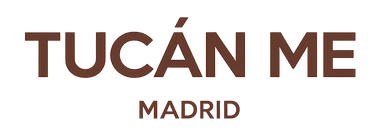 Logotipo con la inscripción “TUCÁN ME” en color marrón y la palabra “MADRID” debajo sobre un fondo blanco.