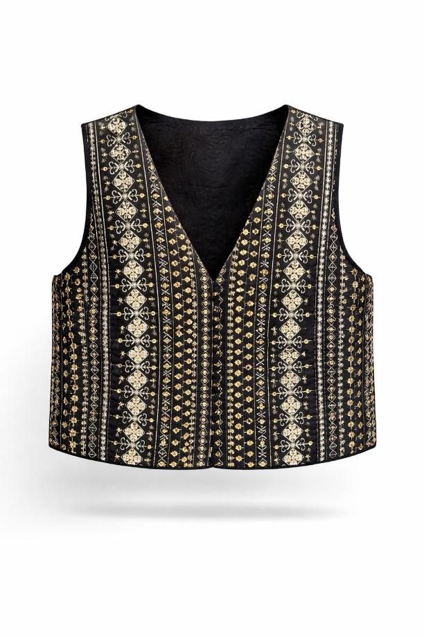 Chaleco negro sin mangas con escote en V y un estampado vertical dorado y beige ornamentado sobre fondo blanco.