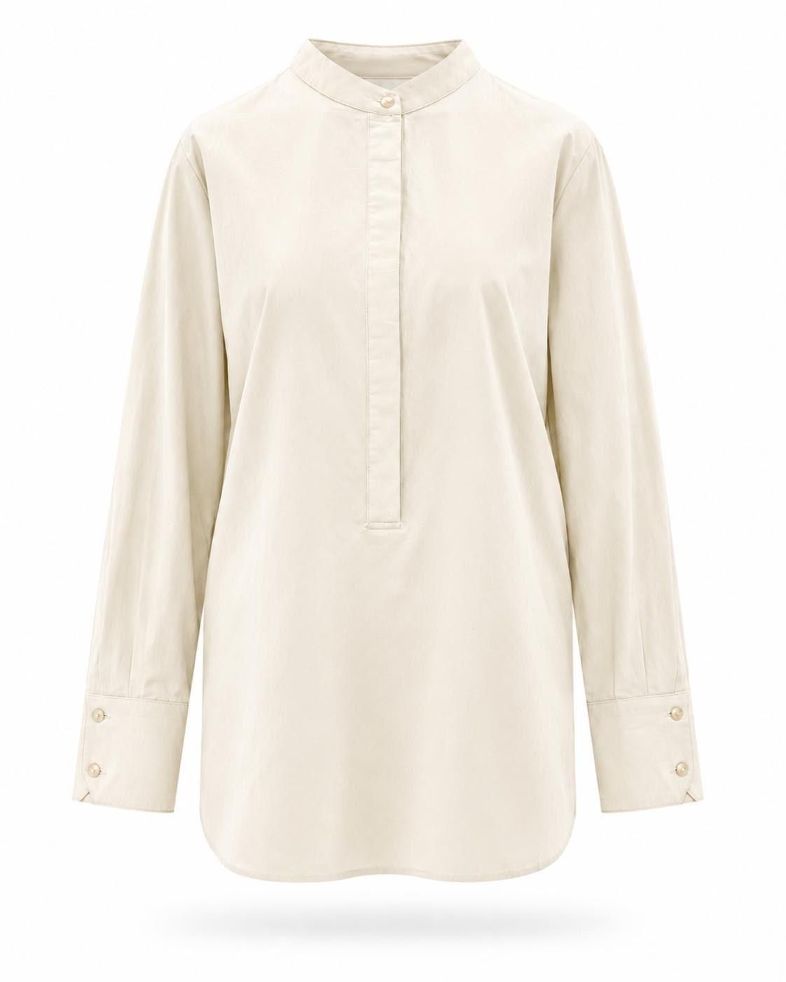 Blusa color crema de manga larga con botones, cuello mandarín y detalles en los puños sobre fondo blanco.