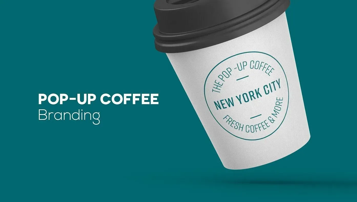 Una taza de café emergente con tapa negra flota en el aire.