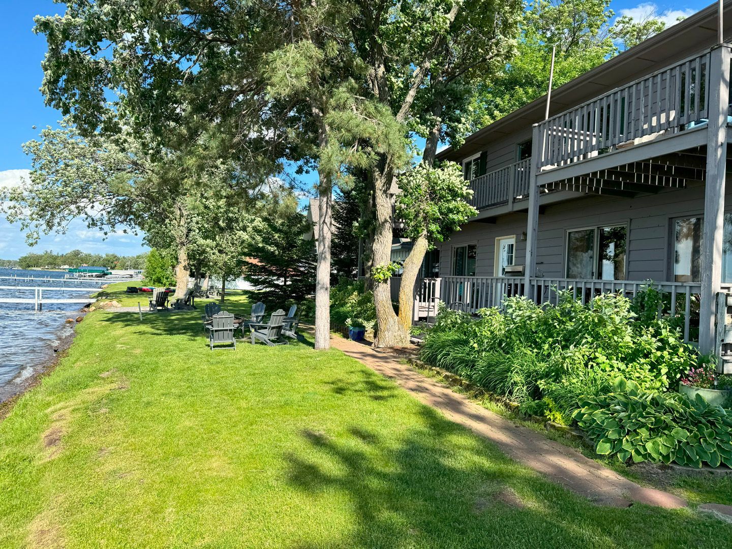A large house is sitting on the shore of a lake.