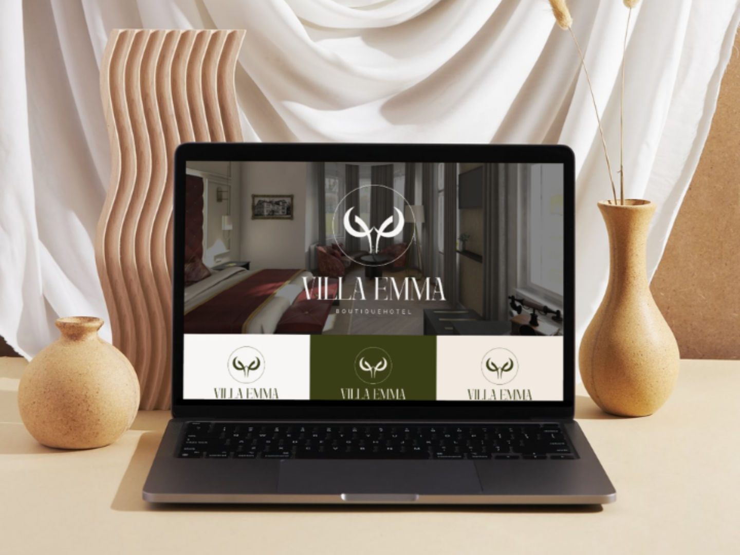 A laptop displaying a website for luxury brands on a desk with subtle decorations and vases