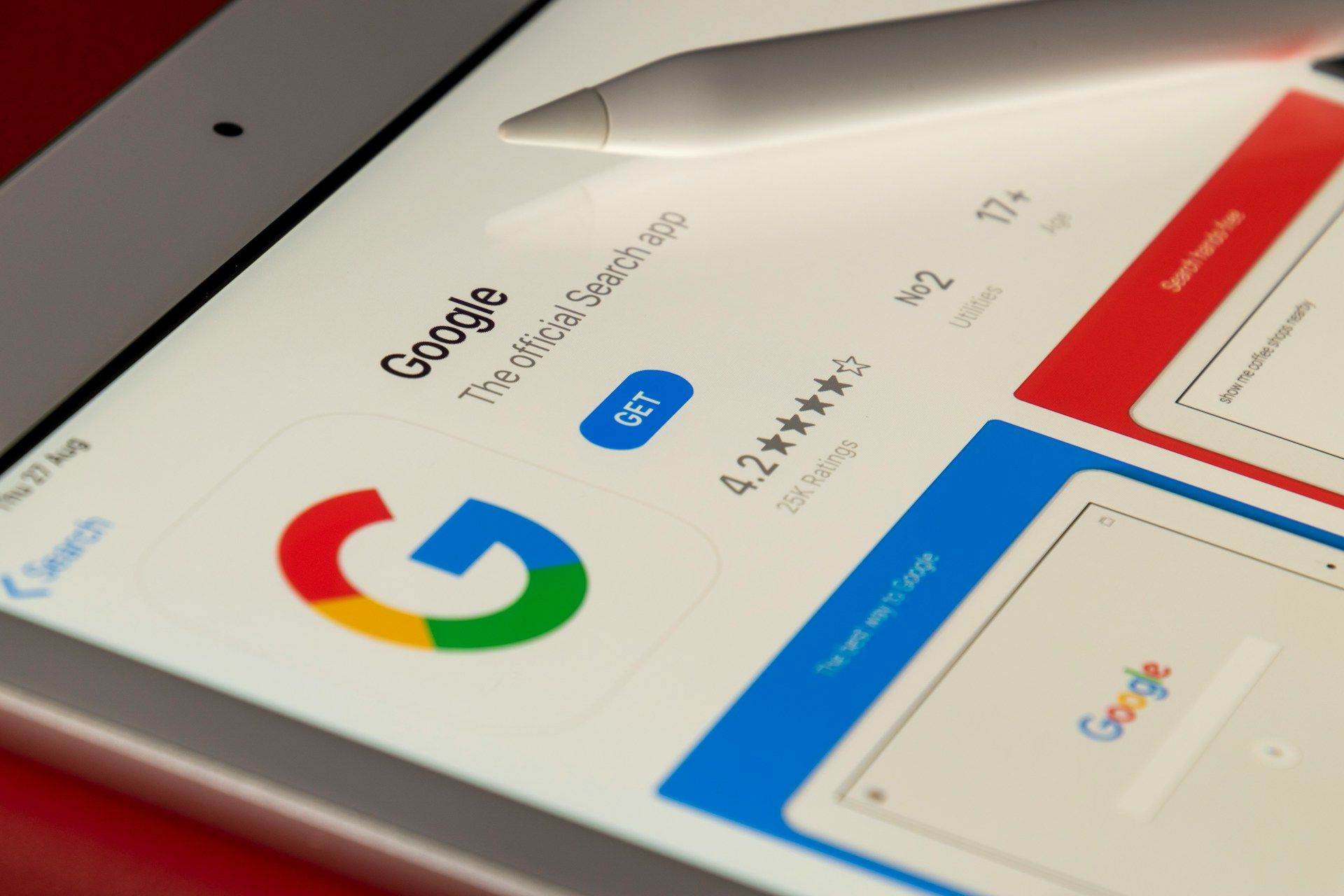 Google search result page on a tablet with the multicolor G logo and blue/red app cards