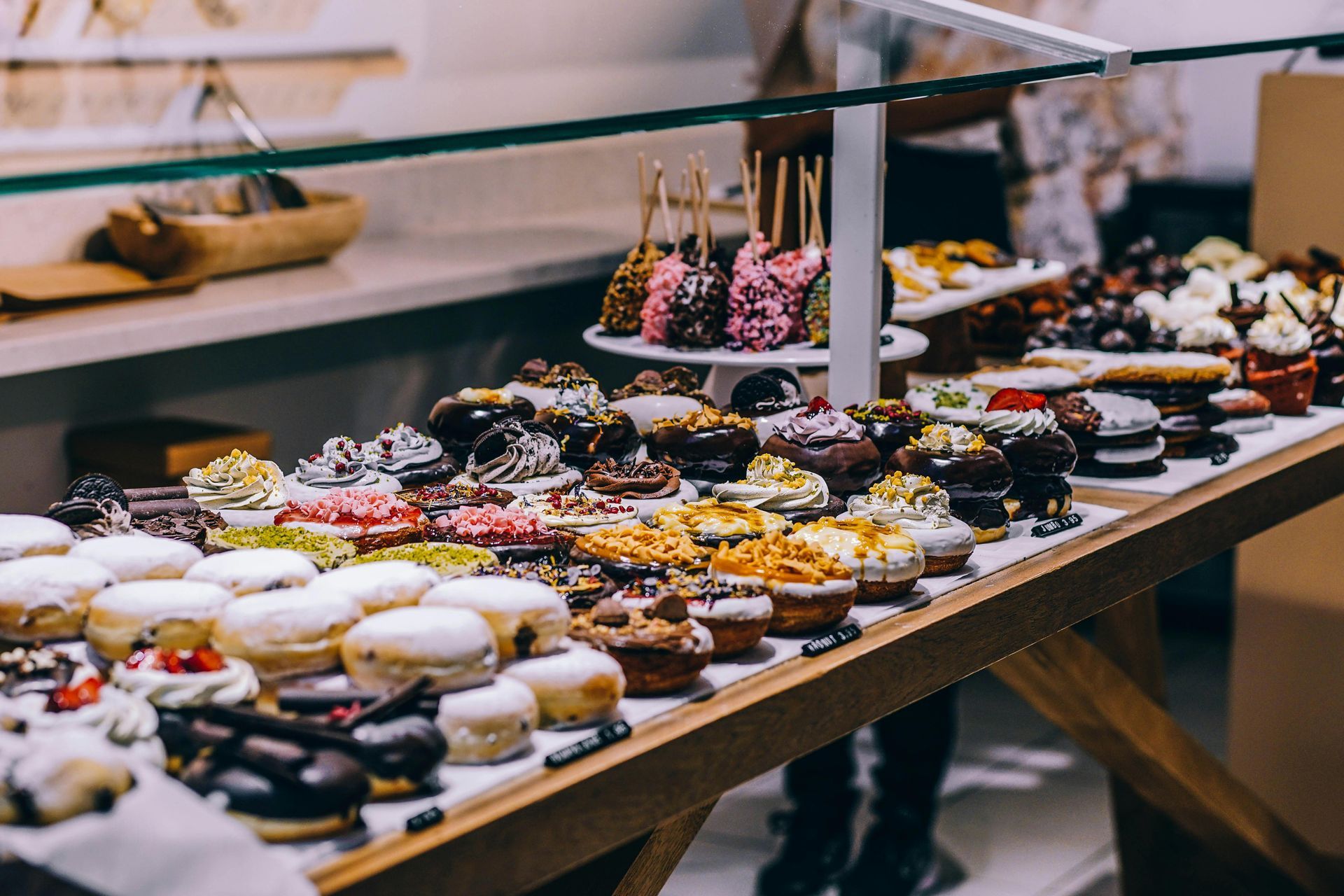 Display case with various decorated pastries and treats.