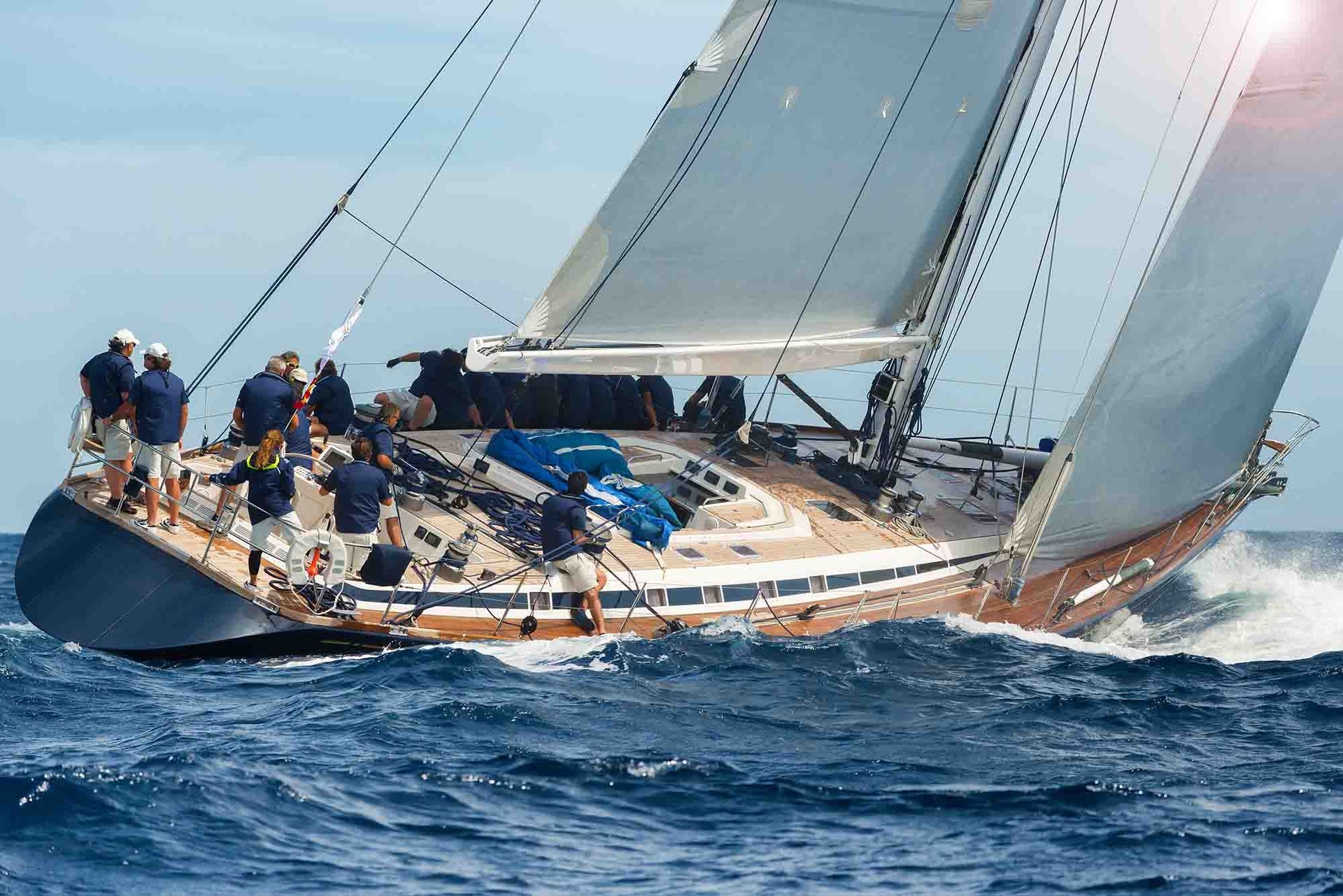 A sailboat is floating on top of a large body of water.