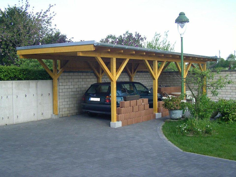Carport in Gelb, gefertigt von Thüs Zimmermeister GmbH Zimmerei-Holzbau