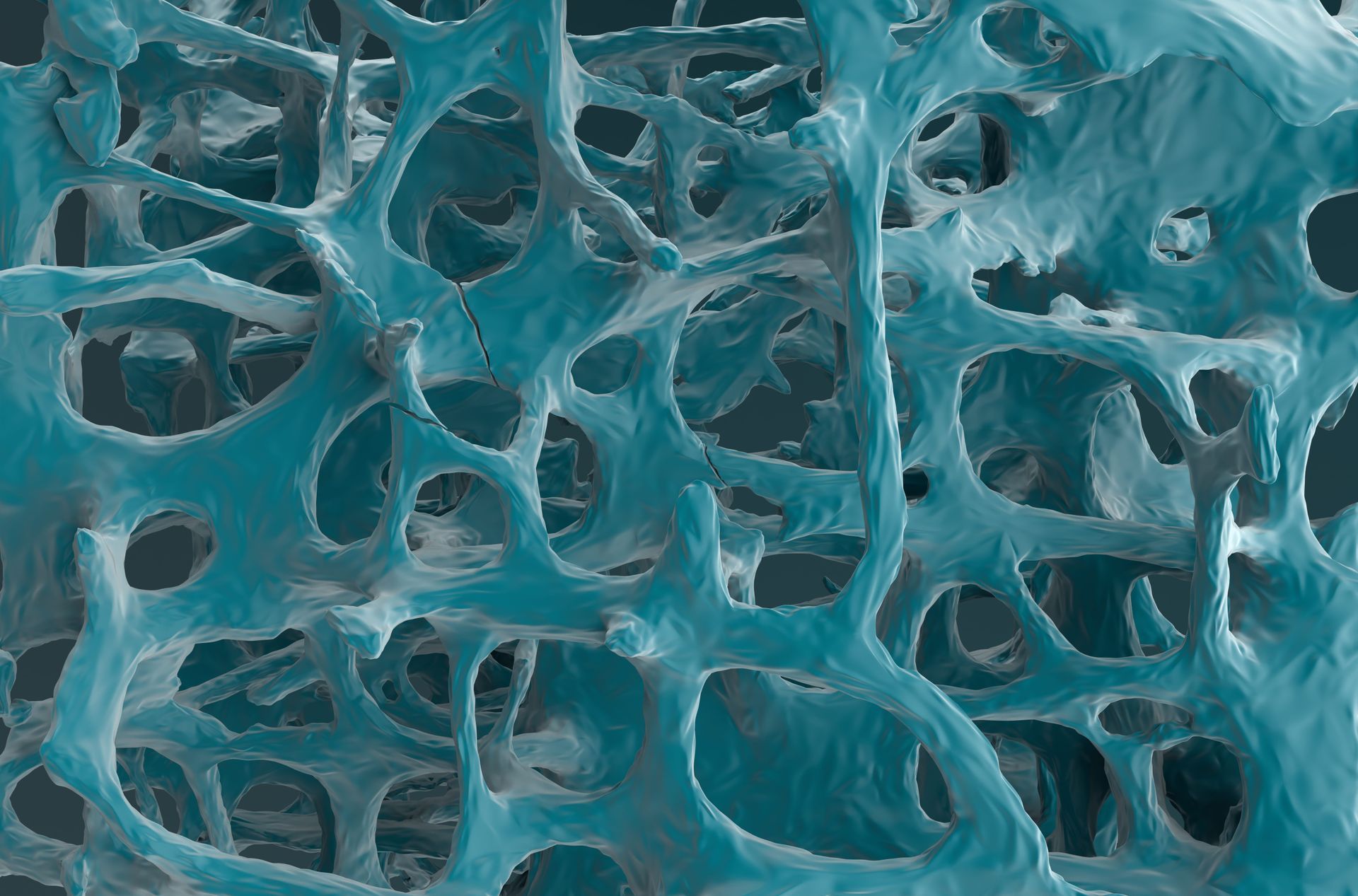 Primer plano de una superficie abstracta porosa de color azul verdoso con agujeros orgánicos en forma de malla.