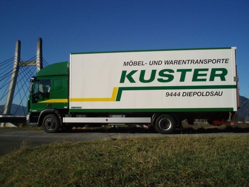 Green and white Kuster truck with 