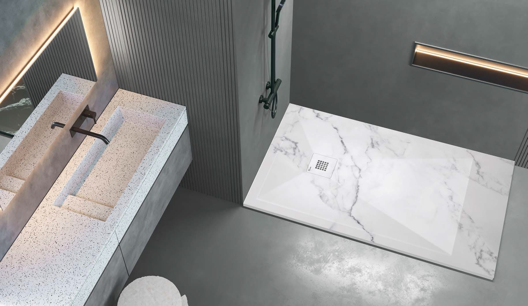 Un baño con lavabo, inodoro y ducha.