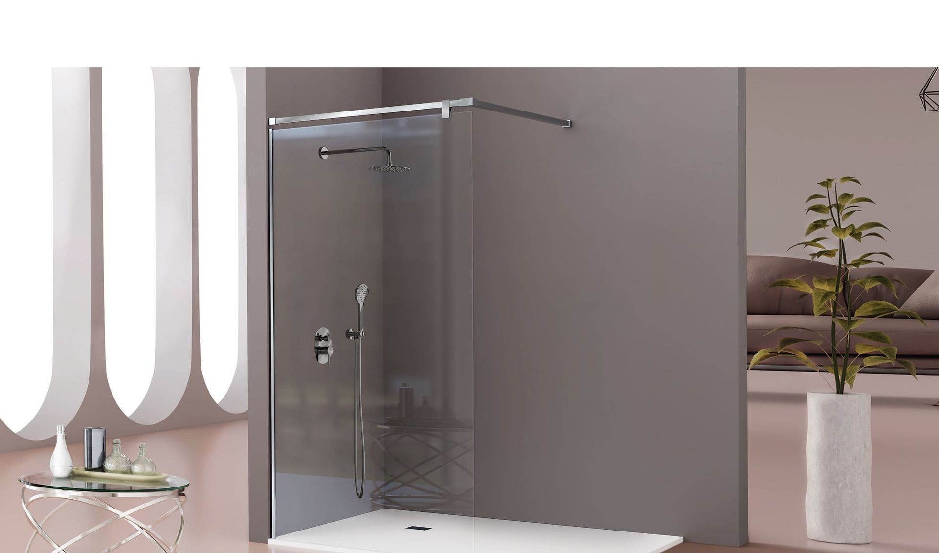 Un baño con ducha a ras de suelo y un sofá.