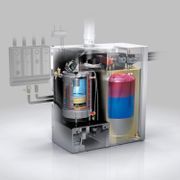 Vista en corte de una máquina industrial que muestra sus componentes internos y fluidos en varios colores.