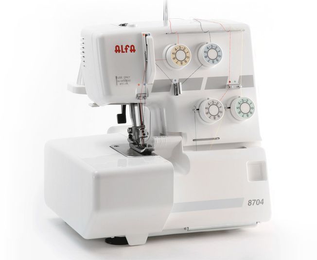 Una máquina de coser blanca con la palabra alfa escrita en ella