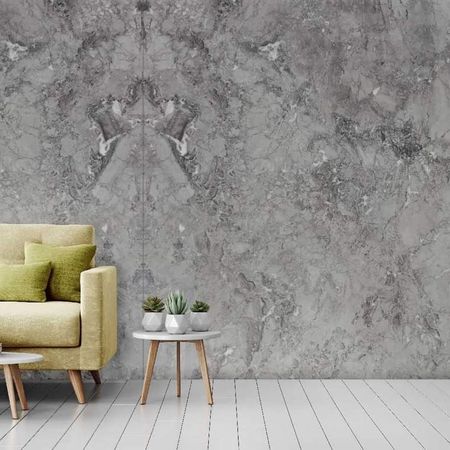 Eine graue Wand mit Steinmuster