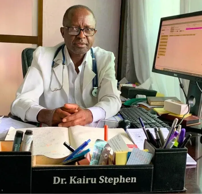 A doctor with his arms crossed and a stethoscope around his neck