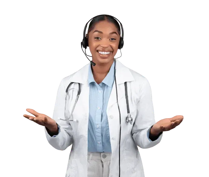 A woman in a lab coat is wearing a headset and smiling.