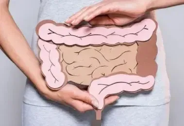 A black and white photo of a kitchen with stainless steel ducts.