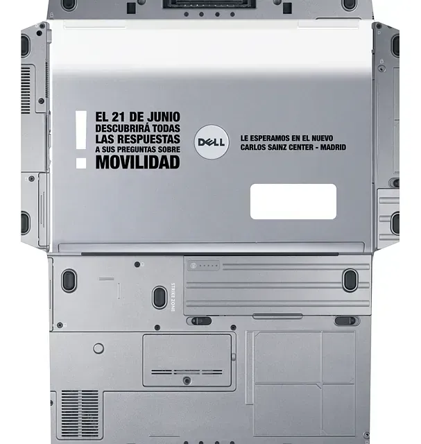 Back of a silver Dell laptop with text: