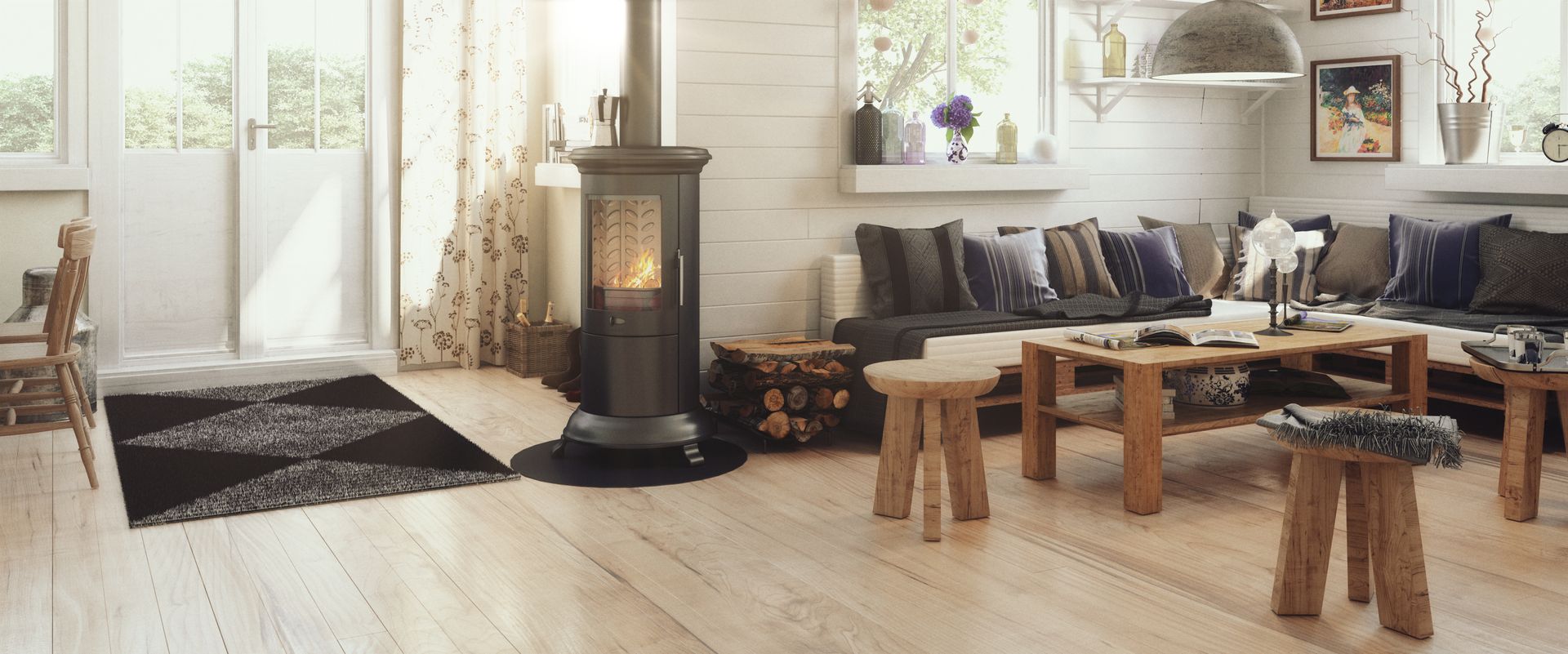 Un salon chaleureux avec un poêle à bois, un grand canapé d'angle avec des coussins gris, des tabourets en bois et un tapis noir à motifs.