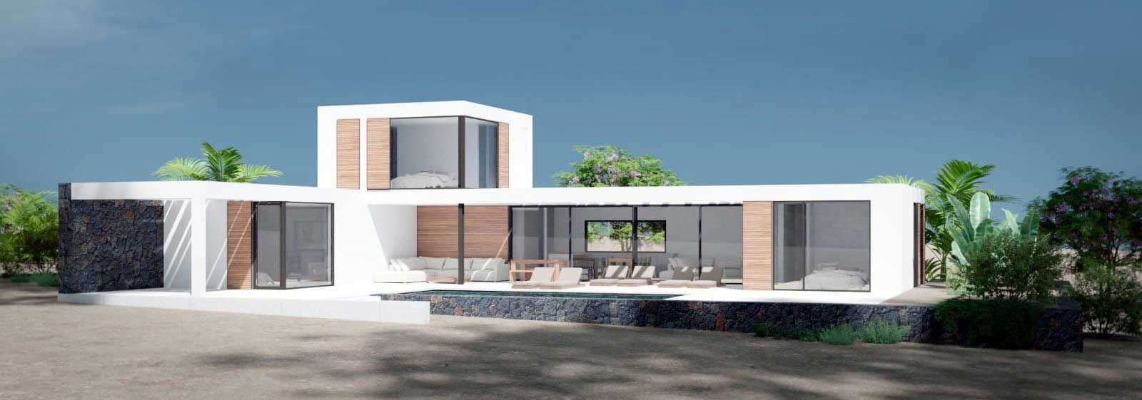 Moderna casa blanca con grandes ventanales y un segundo piso adicional, rodeada de vegetación, bajo un cielo azul.