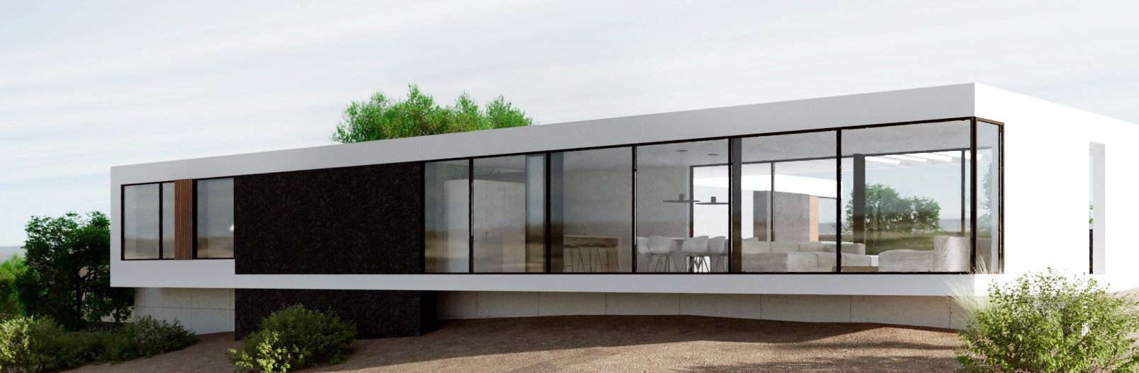 Casa moderna, blanca y con grandes ventanales. Ubicada en una ladera, con vegetación y un cielo neutro visible.