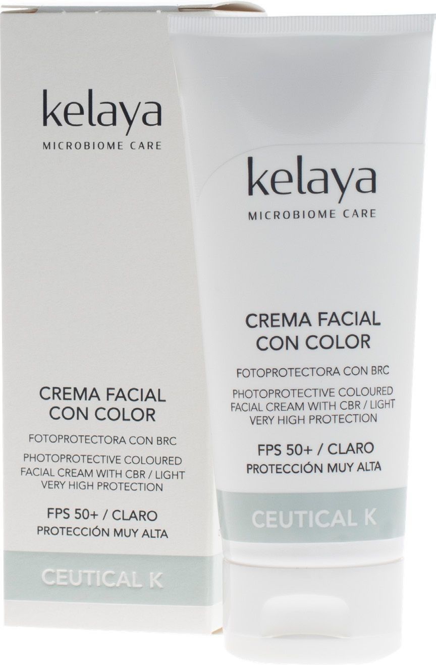 Un tubo blanco y una caja a juego de protector solar facial con color Kelaya Microbiome Care con SPF 50+ en un tono claro.