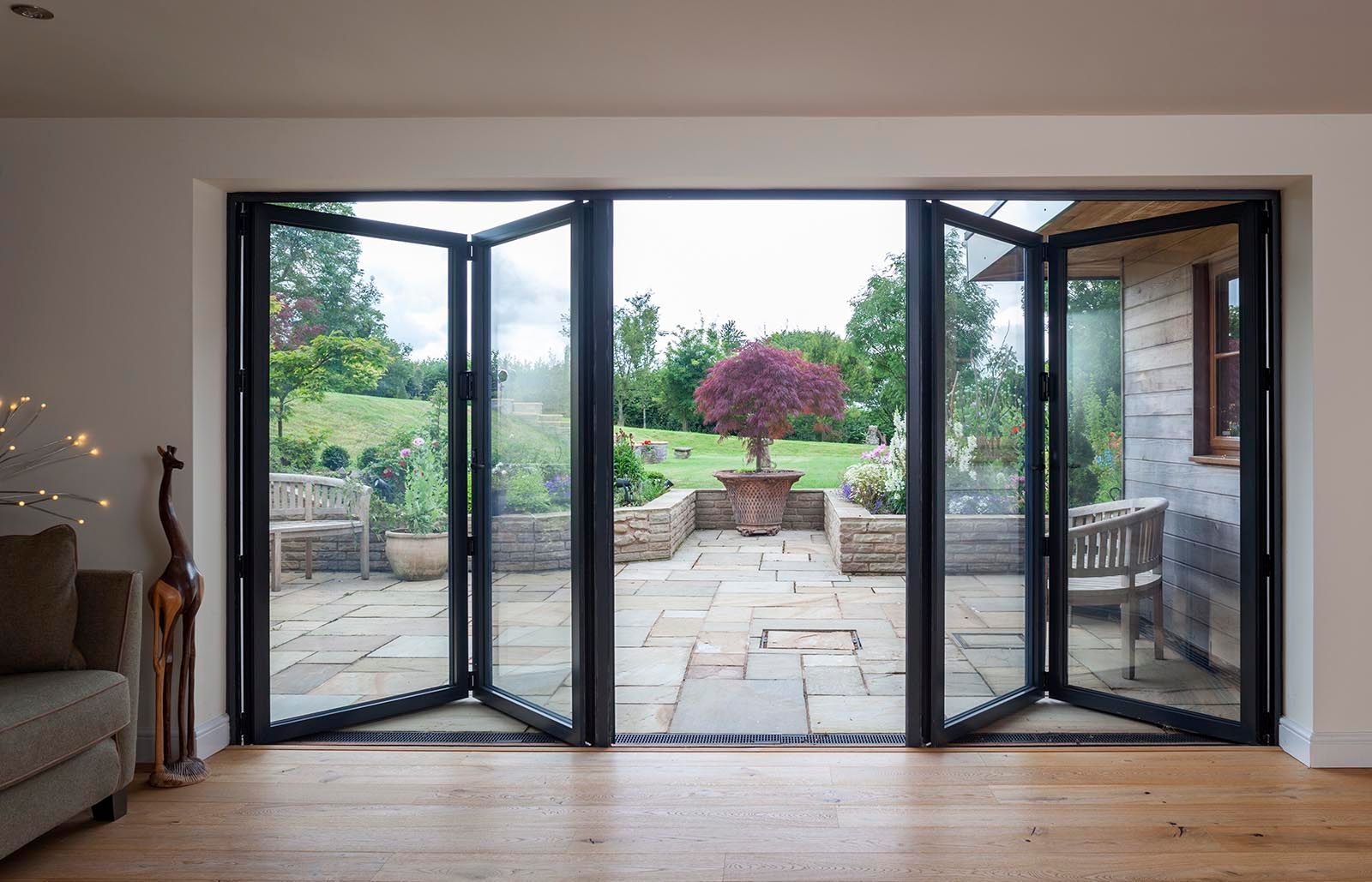 A living room with sliding glass doors leading to a patio.