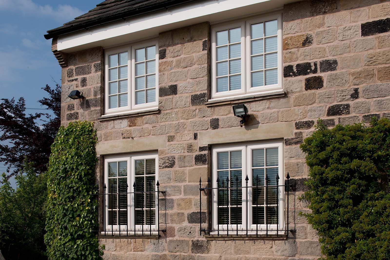 A brick house with a lot of windows on it