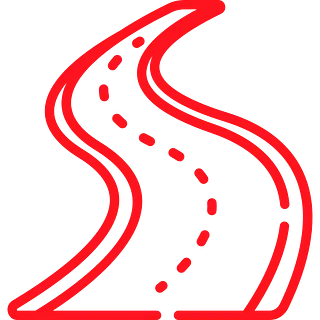 Carretera roja y sinuosa con línea central discontinua.