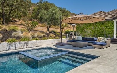 Photo of the swimming pool at Calistoga Wine Ranch Property, surrounded by the beautiful Nappa Valley Country Side.