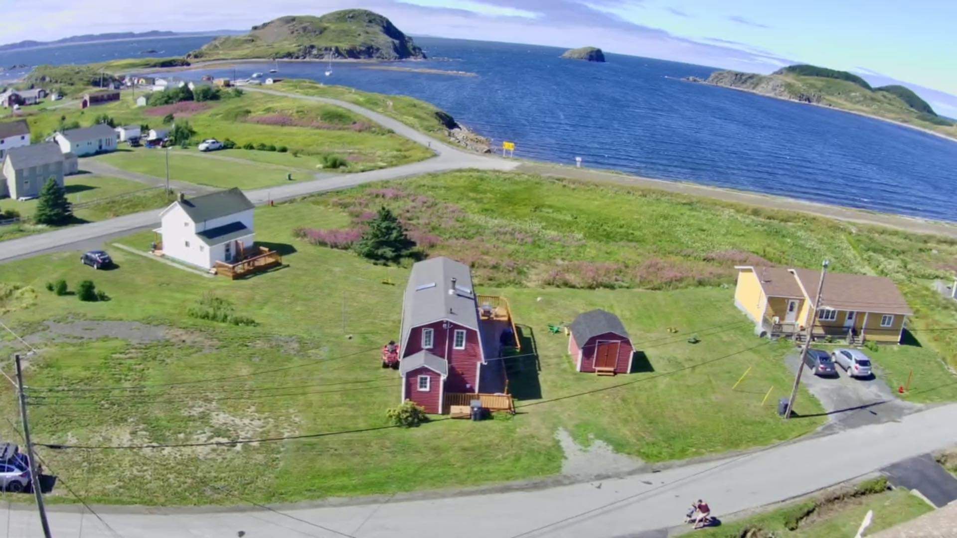 An aerial view of a small town next to a body of water