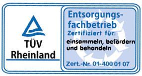 Ein blau-weißes Schild mit der Aufschrift TÜV Rheinland