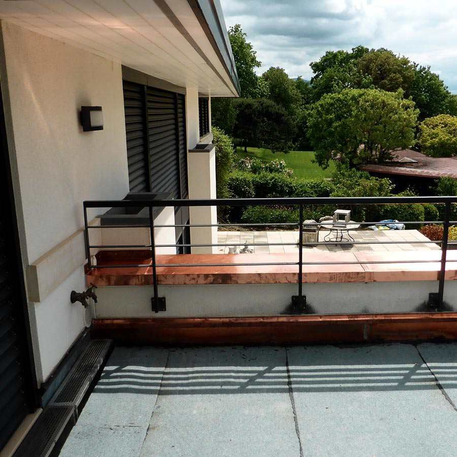 A balcony with the letter c on the wall