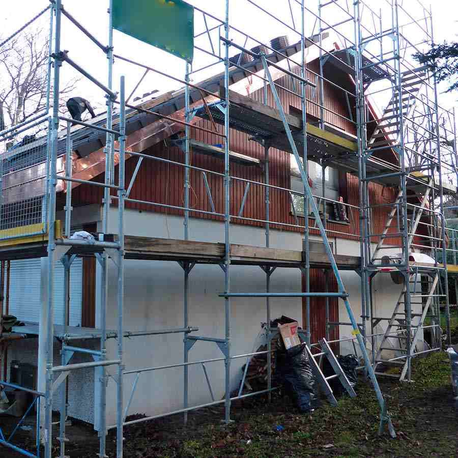 A house is being built with scaffolding around it