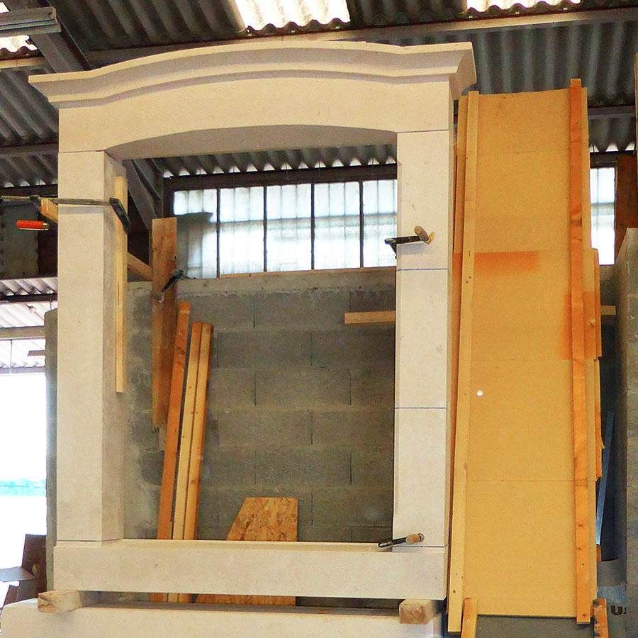A wooden door is being built in a warehouse