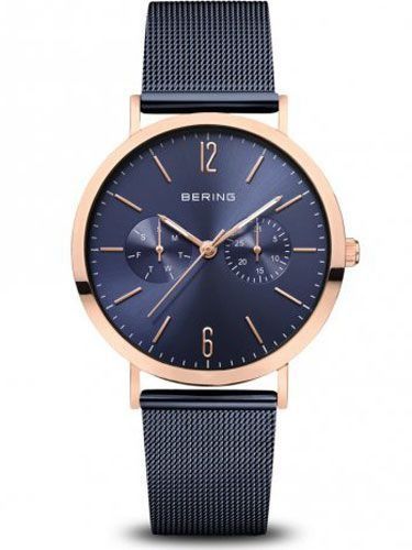 Un reloj Bering con esfera azul y correa de malla.