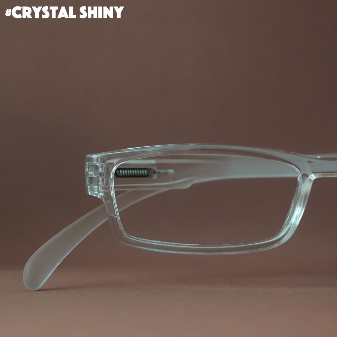 Eine Lesebrille mit in crystal shiny auf braunem Hintergrund.
