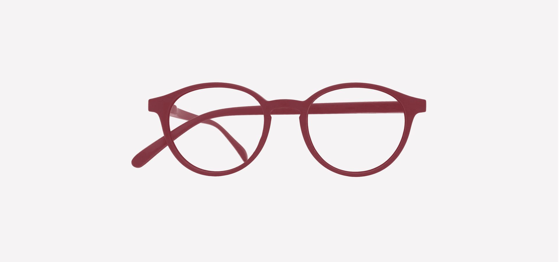 Eine rote Lesebrille auf weißem Hintergrund.