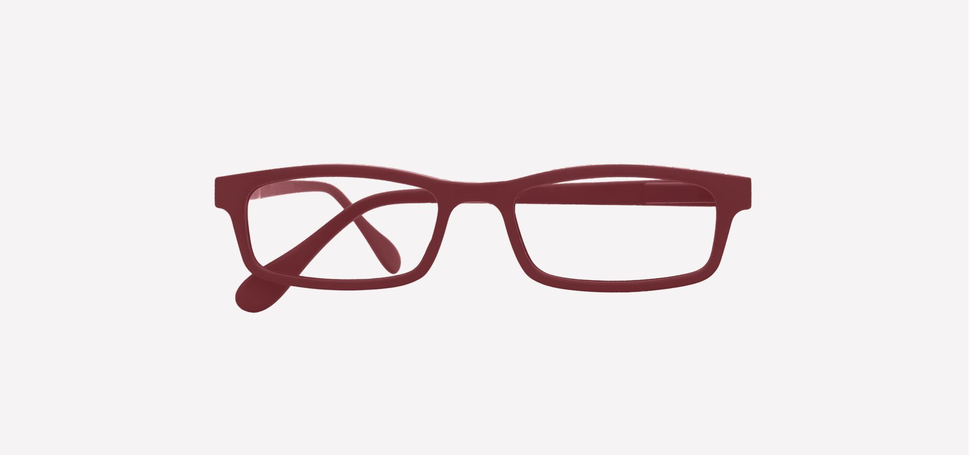 Eine rote Lesebrille auf weißem Hintergrund.