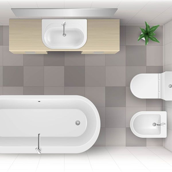 Eine Luftaufnahme eines Badezimmers mit Badewanne, Waschbecken, Toilette und Bidet.