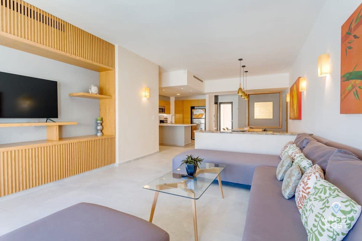 A living room with a couch and a flat screen tv